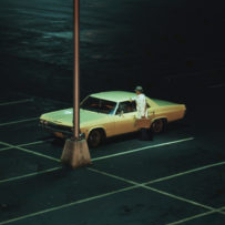 Parking lot at night - lone car